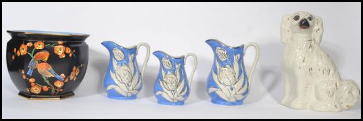 A collection of 19th century Victorian ceramics to include a Staffordshire fireside dog with inset