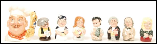 A group of eight Royal Doulton boxed Doultonville figures to include Chef , Miss Studious , Albert