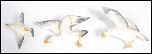 A group of three ceramic wall hanging graduating Seagulls in flight dating to the mid 20th century