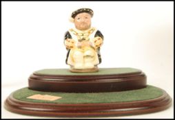 A Royal Doulton Limited Edition character Toby Jug Henry VIII D7047 237/2500 with two tier wooden