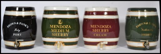 A good set of four porcelain ceramic liqueur casks in shape of barrels with notation for sherry