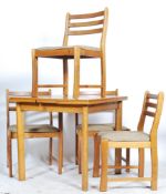 A contemporary late 29th century ash wood draw leaf dining table and chairs. The chairs with