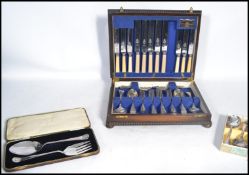 A vintage early 20th century oak cased canteen of silver plated six setting cutlery together with