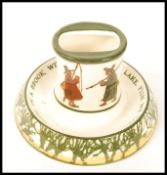A Royal Doulton Isaac Walton Ware matchbox holder and matchstrike ashtray 