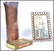 A group of three vintage 20th century Trench Art brass items to include a picture frame with a