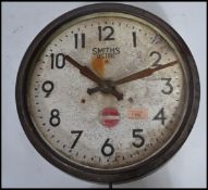 A vintage retro 20th century Smiths Sectric circular wall clock having faceted hands. Notation to