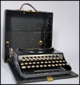 A vintage retro 20th century industrial portable typewriter by Remington. The Home Portable