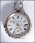 An early 20th century silver cased pocket watch by Henry E Peck Swiss made. The white enamel face