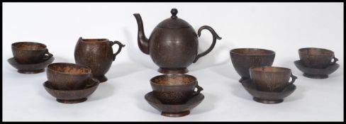 A believed early 20th century Asian antique coconut five piece tea set comprising of a teapot, sugar