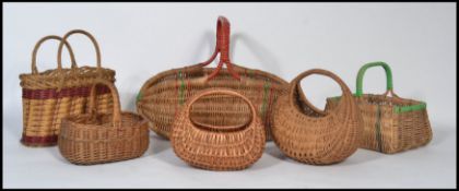 A group of vintage 20th century child's wicker baskets of various form along with a larger