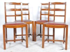 A set of 4 1930's Art Deco oak rail back dining chairs being raised on squared legs united by