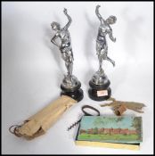 A pair of vintage 20th century chrome classical figurines on stepped pedestal bases along with a