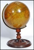 A 19th Century New Terrestrial Globe, published by H Collins of London, on a turned mahogany stand