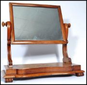 A 19th century  Victorian walnut swing frame dressing table mirror, the serpentine fronted base with