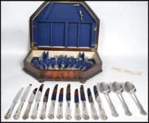 A good 20th century oak cased silver plated canteen of cutlery. Covers for six persons by
