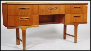 A retro teak wood 20th century sideboard / dressing table constructed with a series of drawers