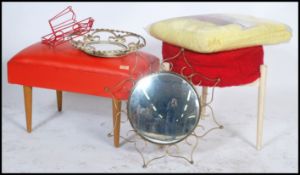 A collection of vintage mid century stools having red vinyl upholstery together with a mid century