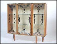A vintage mid 20th century china / display cabinet. Raised on tapering supports with glass sliding