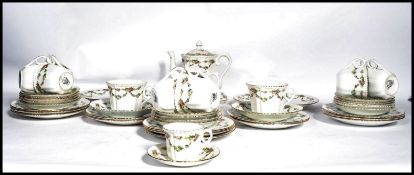 A vintage early 20th century china tea service by Phoenix Ware having a chintz pattern. The