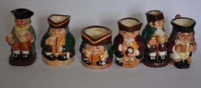 A commemorative set of Royal Doulton character miniature Toby jugs (6)