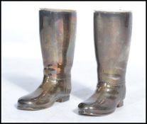 A pair of 20th century silver plated drinks measures in the form of gentlemans boots. Complete