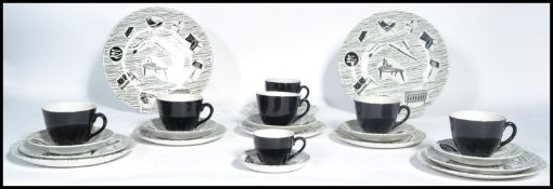 A collection of mid 20th century Homemaker ceramics in black and white to include cups, saucers ,