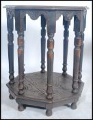 A Victorian carved oak 19th century centre / penny table. Raised on turned legs with octagonal