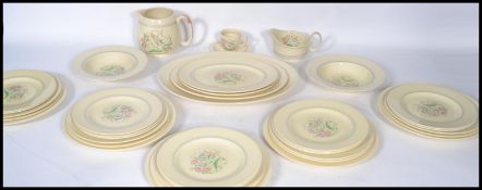 A 1930's Susie Cooper Dresden Spray dinner service set consisting of cups saucers and side plate