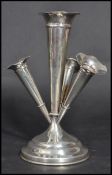 An early 20th century Edwardian silver hallmarked Epergne having a central fluted vase with three