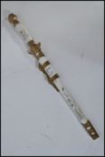 A 20th century Chinese decorative miniature sword letter opener paper knife. Having a brass