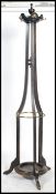 A Victorian oak tall cylindrical tapering stick stand / hallstand having peripheral stretchers and
