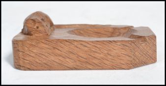 A Robert ' Mouseman ' Thompson oak ashtray of rectangular form with canted corners and with