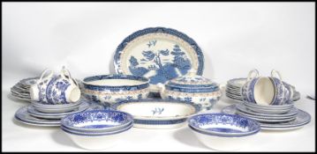 An extensive Booths Old Willow Ware blue and white ceramic dinner service consisting of plates ,