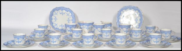 A Royal Crown Derby twelve person blue and white ceramic tea service along with three matching