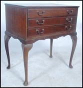 An early 20th century Canteen of cutlery on legs. The mahogany case raised on cabroile legs with