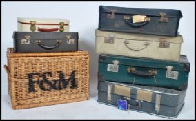 A vintage 20th century large Fortnum and Mason wicker basket along with a quantity of vintage