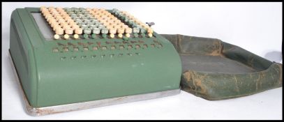 A vintage industrial Comptometer key-driven mechanical calculator, counting machine with original