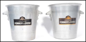 A pair of vintage 20th century Pommery and Greno Champagne wine cooler ice buckets. White metal with