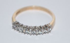 A hallmarked 9ct 7 stone gold ring set with 7 white stones.   Hallmarked  Sheffield. Size R.  Weight