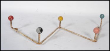 A vintage retro 20th century sputnik atomic set of coat hooks in a painted finish with multi