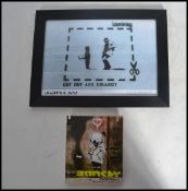 A framed and glazed Banksy Bristol street artist print Cut Out and Collect 6/50 along with Banksy