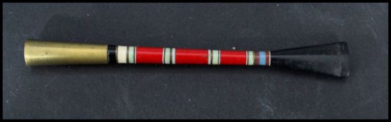 A vintage early 20th century Art Deco cheroot / cigarette holder. The stem constructed of banded