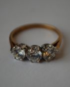 A hallmarked 9ct 3 stone gold ring set with 3 white stones. Hallmarked Sheffield. Size M. Weight 2.