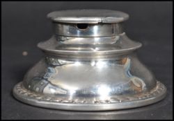 An early 20th century silver hallmarked Edwardian inkwell of stepped circular form. Hallmarked dor