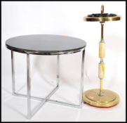 A 1970's chrome and smoked glass coffee table of circular form in the manner of Eileen Grey.
