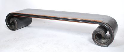 An early 20th century Chinese elm wood scroll table of small proportions having visible dovetail