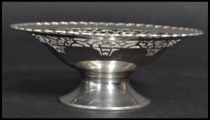 An early 20th century Art Deco silver hallmarked footed bon bon dish. The flared bowl having a
