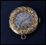 An 18ct gold and diamond set ladies watch by Behar having faceted hands with Arabic numeral