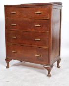 A 1930's Art Deco oak chest of drawers being raised on cabriole legs with pad feet having a straight