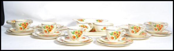 A vintage 20th century Art Deco tea service by Crown Ducal in the Marigold pattern consisting of